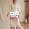 This image shows a Premium Heavy Flex Cotton Floral Co-Ord Set featuring purple and golden floral placement prints at the borders. The outfit consists of a comfortable, loose-fitting off-white tunic/kurti with light work along the notched neckline, paired with matching wide-leg palazzo pants.Product OverviewOutfit Type: Ethnic Co-Ord Set / Tunic with PalazzosFabric: Premium Heavy Flex CottonColor: Cream / Off-White base with vibrant purple and golden floral accentsDesign Elements:Notched neck detailing with light embroidery/thread workPlacement floral borders along the sleeve cuffs, kurta hem, and palazzo bottomsAvailable Sizes: M, L, XL, XXL, 3XL, and 4XL (as indicated in the overlay text