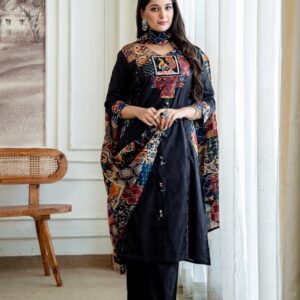 Premium Cotton Kalamkari Print Patchwork Suit Set. It features a solid black straight-cut kurta accented with a vibrant multi-colored Kalamkari printed patchwork yoke and fabric hanging tassels down the front placket. The set is completed with matching solid black wide-leg palazzo pants and a coordinated all-over Kalamkari printed dupatta. This popular traditional ensemble is available across several boutique platforms and ethnic wear marketplaces: